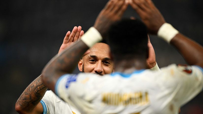 Aubameyang celebrates with a teammate (©Stuart Franklin/Getty Images)
