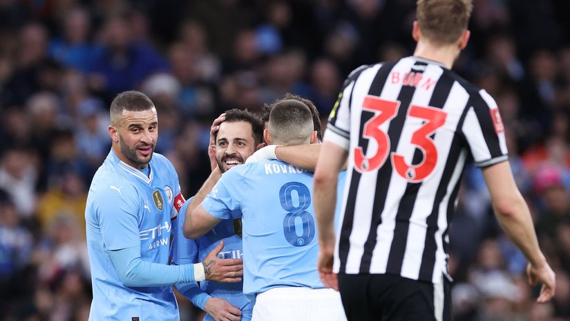 Bernardo celebrates with teammates after scoring a brace (©Alex Livesey/Getty Images)
