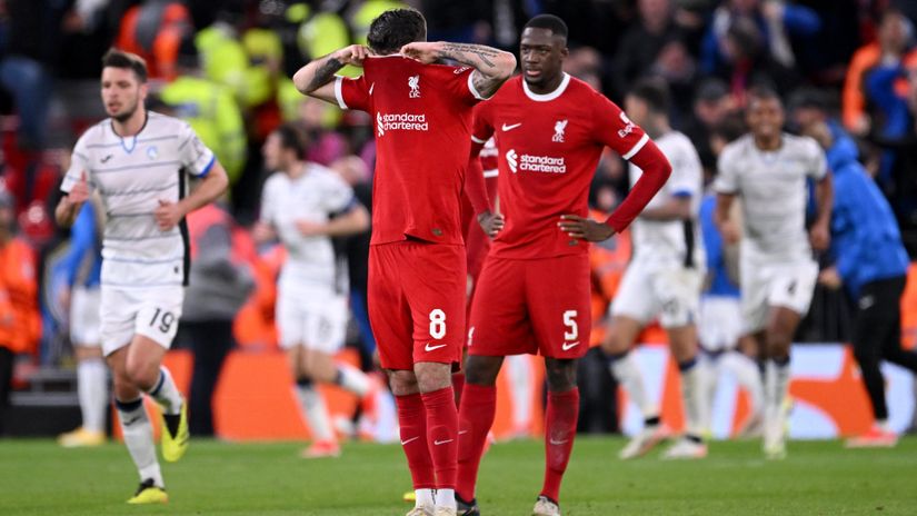 Szoboszlai and Konate in despair, while Atalanta players celebrate a massive win (©Stu Forster/Getty Images)