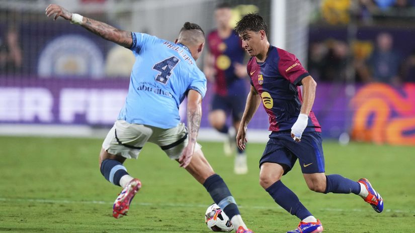 One of the scorers, Pablo Torre, and Man City's Kalvin Phillips(©Rich Storry/Getty Images)