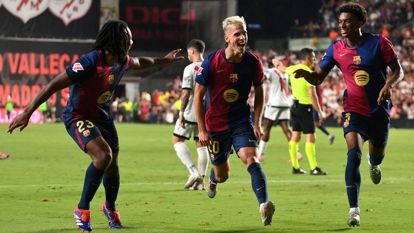 Dani Olmo celebrating with Kounde and Balde (©Getty Images)