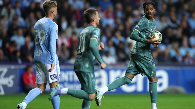 Djed Spence runs with the ball after scoring against Tottenham (©Matthew Lewis/Getty Images)