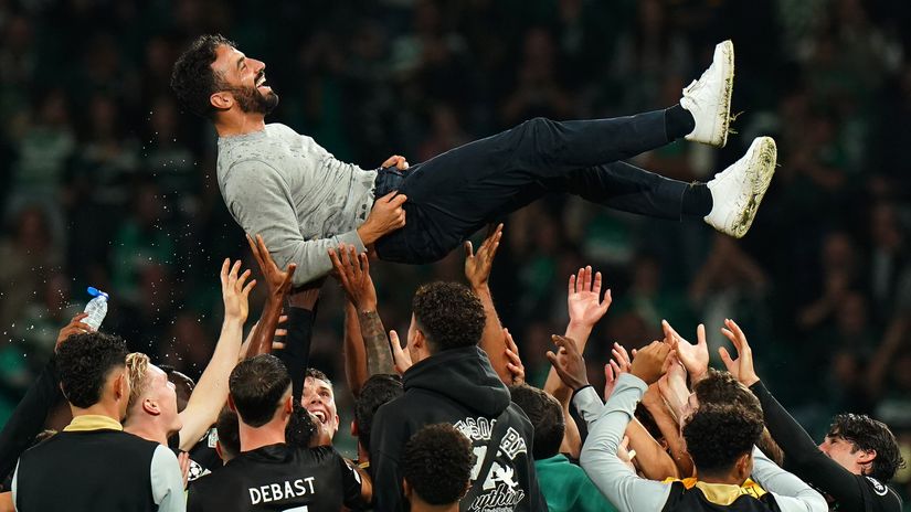Ruben Amorim is thrown into the air by his players after thumping Manchester City (©Gualter Fatia/Getty Images)
