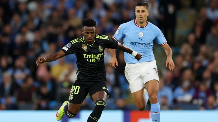 Vinicius Jr. and Rodri fight for the ball (©Clive Brunskill/Getty Images)