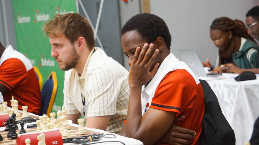 Caption: Haruna Nsubuga considers his next move at the Kireka Open Chess Championship © Gilbert Wandera