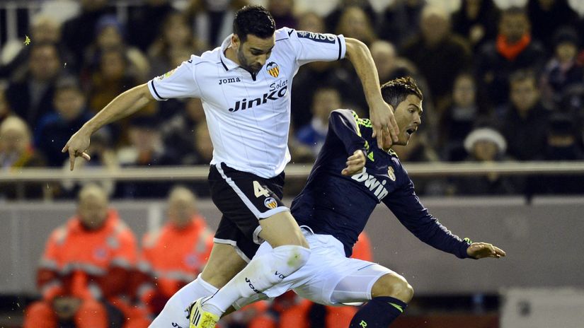 Rami of Valencia and Ronaldo of Real Madrid battling on the pitch, back in 2013(©AFP)