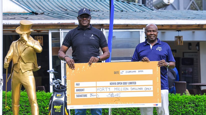 KBL Managing Director Mark Ocitti (L) presents a cheque ©Courtesy