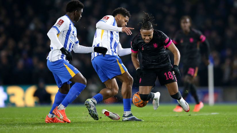 Christopher Nkunku of Chelsea is left without his shoe by Georginio Rutter of Brighton (©Steve Bardens/Getty Images)
