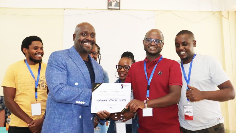 Anthony Ombok presented with the certificate Courtesy/ Boxing Federation of Kenya