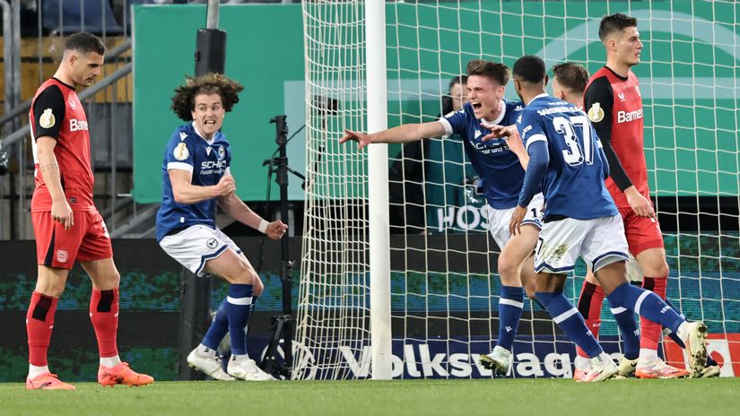 Maximilian Grosser of Arminia Bielefeld celebrates the team's second goal against Leverkusen (©Christof Koepsel/Getty Images) 