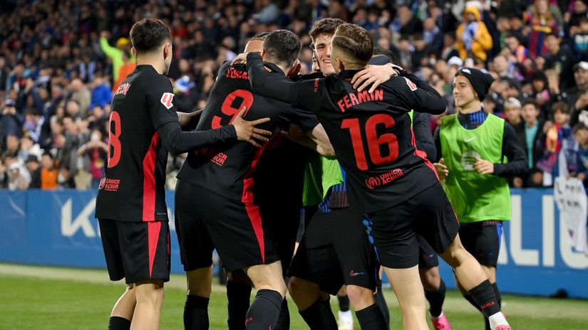 The Catalans celebrate the winning own goal (©Denis Doyle/Getty Images)