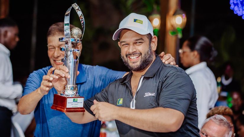 Salvator Ngezendore poses with a trophy/Agencies