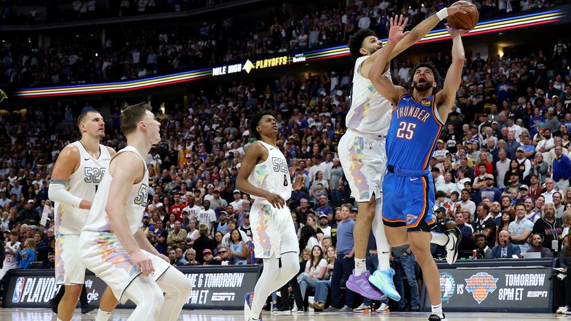 Jamal Murray of the Denver Nuggets blocks a shot by Ajay Mitchell (©Matthew Stockman/Getty Images)