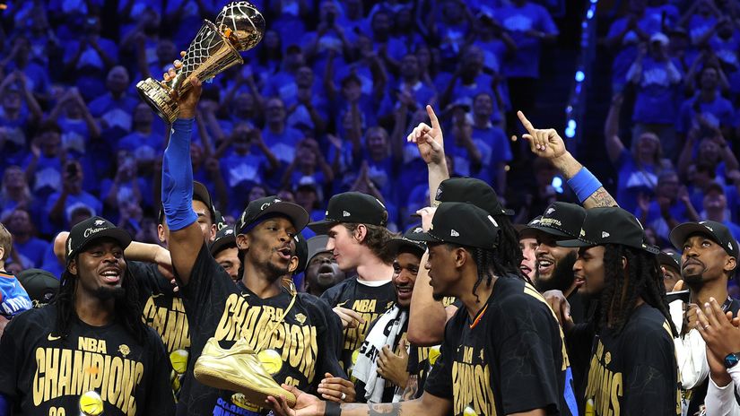 Shai with the championship trophy (©Matthew Stockman/Getty Images)