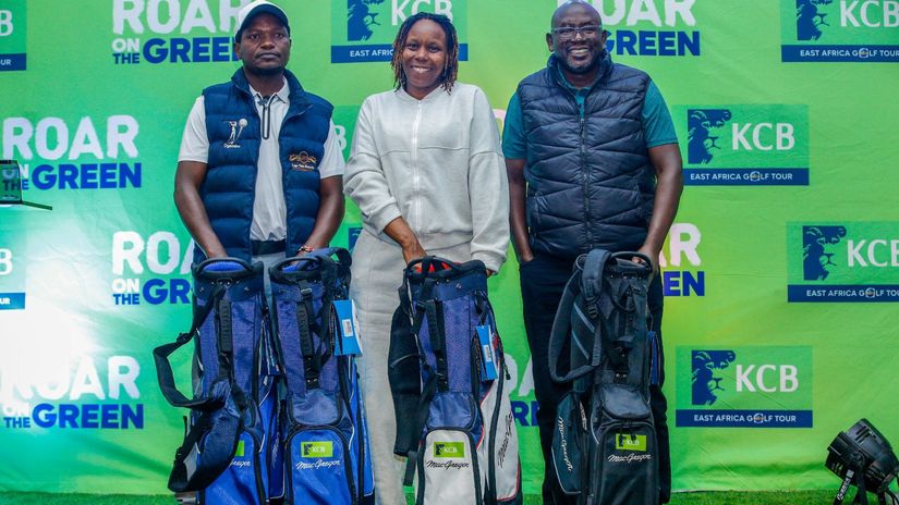 KCB Group Treasurer Anthony Mulisa presents awards to the overall team winners/Agencies