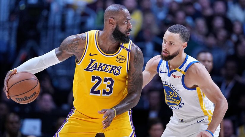 LeBron James in action against Steph Curry (©Michael Owens/Getty Images)