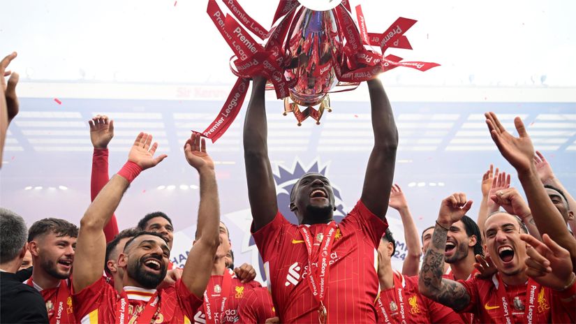 Salah, Konate and other Liverpool players celebrating the EPL title (©Michael Regan/Getty Images/Getty Images For The Premier League)