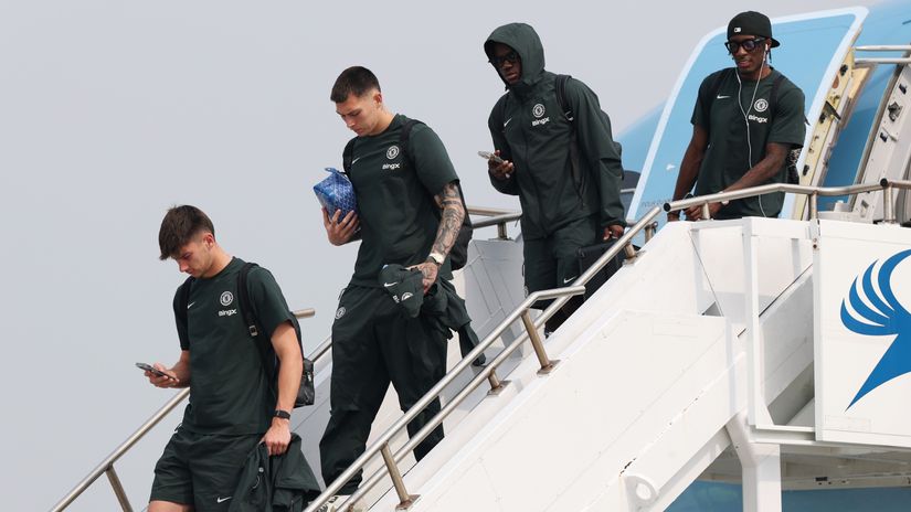 Chelsea players disembark the plane after one of their flights (©Emilee Chinn/Getty Images)