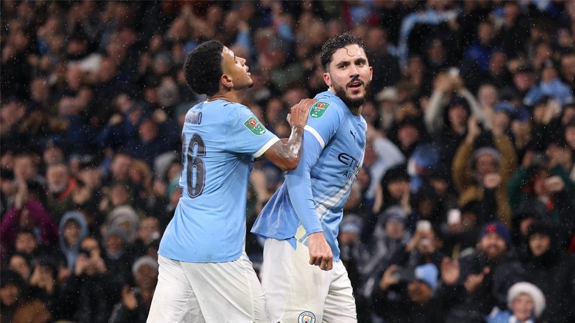 Savinho and Cherki celebrate after the latter's opener (©Carl Recine/Getty Images)
