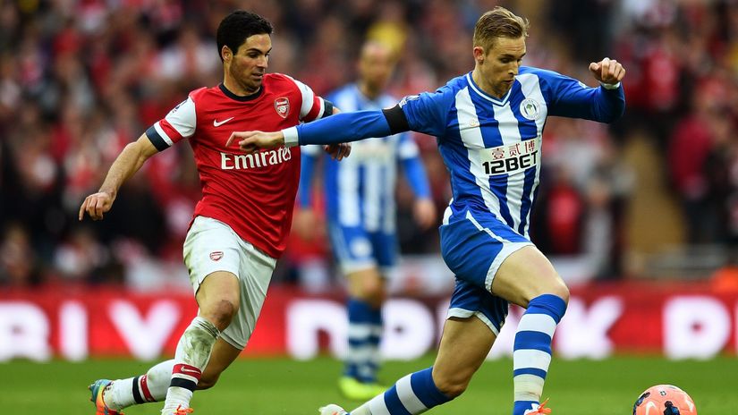 Arsenal captain Mikel Arteta and Callum McManaman of Wigan in action in the FA Cup clash from 12 years ago (©Shaun Botterill/Getty Images)