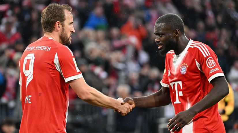Kane celebrates his brace with Upamecano (©Christian Kaspar-Bartke/Getty Images)