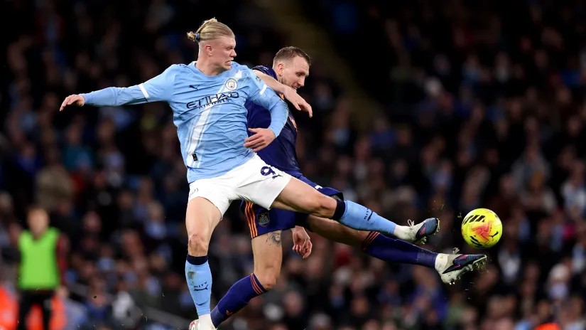 Erling Haaland and Dan Burn (©Getty Images)