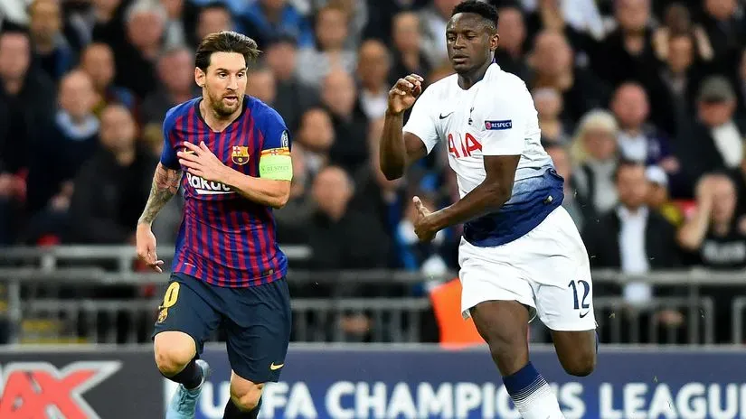 Lionel Messi and Victor Wanyama © AFP