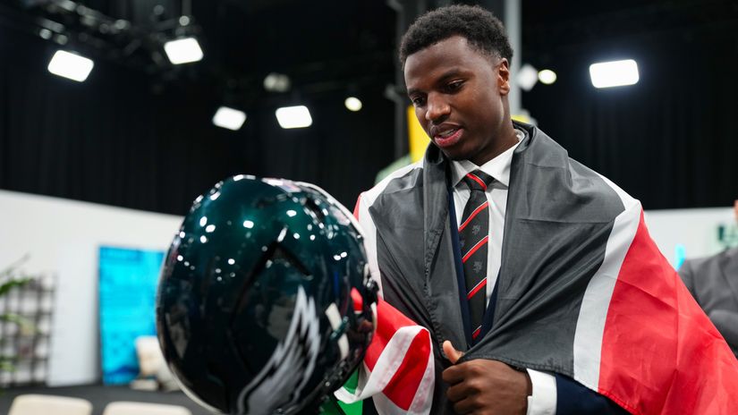 Josh Weru looking at a Philadelphia Eagles helmet on Saturday ©NFL Africa