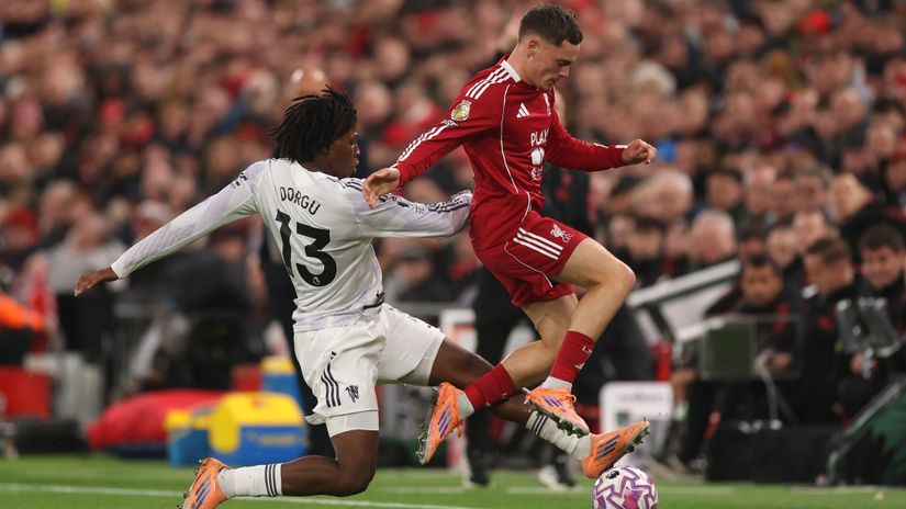 Patrick Dorgu of Man United and Florian Wirtz of Liverpool in action at Anfield last October (©Carl Recine/Getty Images)