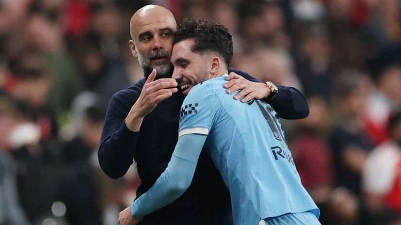 Guardiola & Cherki hugging and sharing a laugh (©Reuters/Paul Childs/Gallo Images)