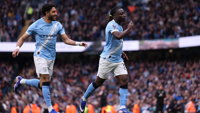 Jeremy Doku celebrates his vital opener with Omar Marmoush (©Naomi Baker/Getty Images)
