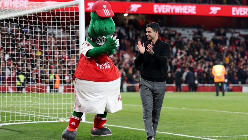 Arteta with the Gunners' mascot celebrating the win against Burnley (©Julian Finney/Getty Images)