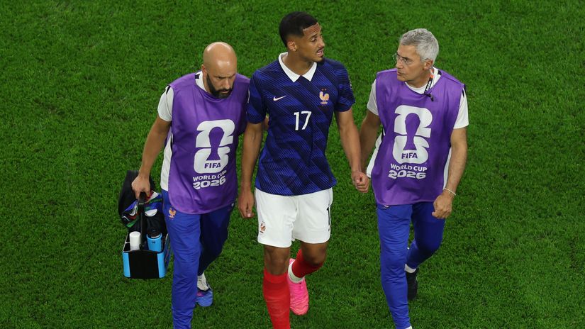 Saliba walks off the pitch after suffering a back injury during the World Cup semi-final against Spain (©Kevin C. Cox/Getty Images)
