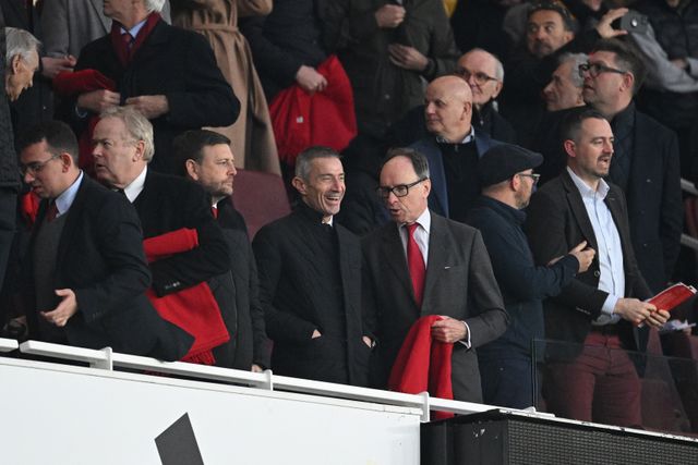Andrea Berta (in the middle) smilling at the Emirates (©Justin Setterfield/Getty Images)
