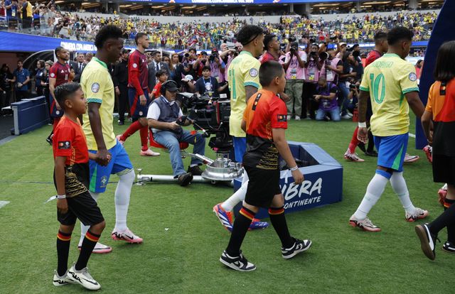 Vini Jr, Raphinha, and Rodrygo entering the pitch ahead of Brazil's 2024 Copa America match against Costa Rica (©Kevork Djansezian/Getty Images)