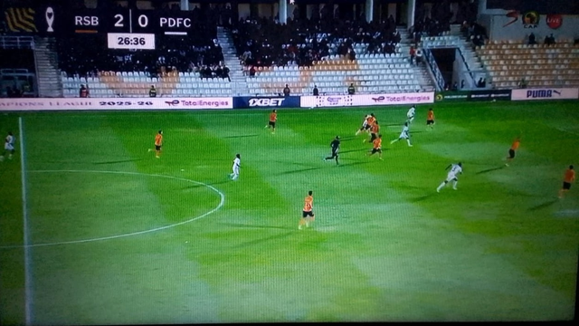 RS Berkane’s compact 4-4-2 mid-block suffocated Power Dynamos’ buildup, with the front two screening central lanes and guiding play wide into preset pressing traps, consistently disrupting Dynamos’ attempts to play through midfield.