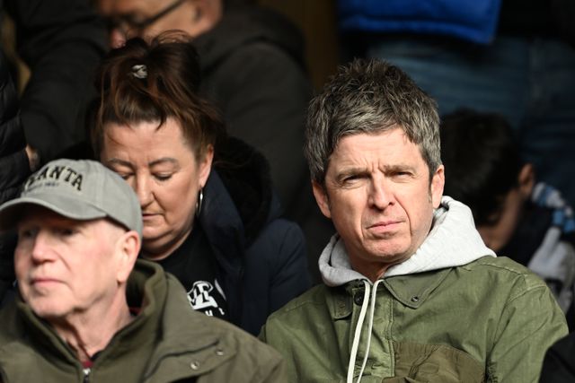 City's wonderwall in the stands... Oasis' Noel Gallagher with the visiting fans at City Ground (©Getty images sport)